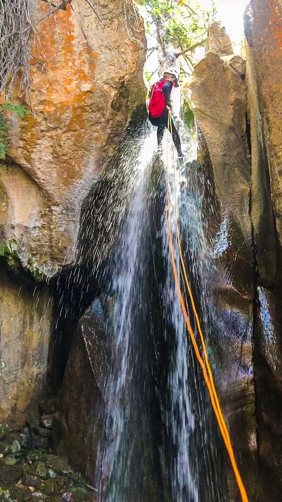 rappelling in a waterfall