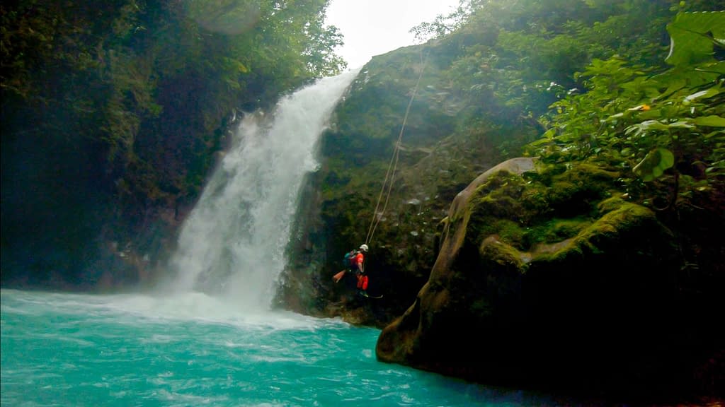 rappelling by a waterfall